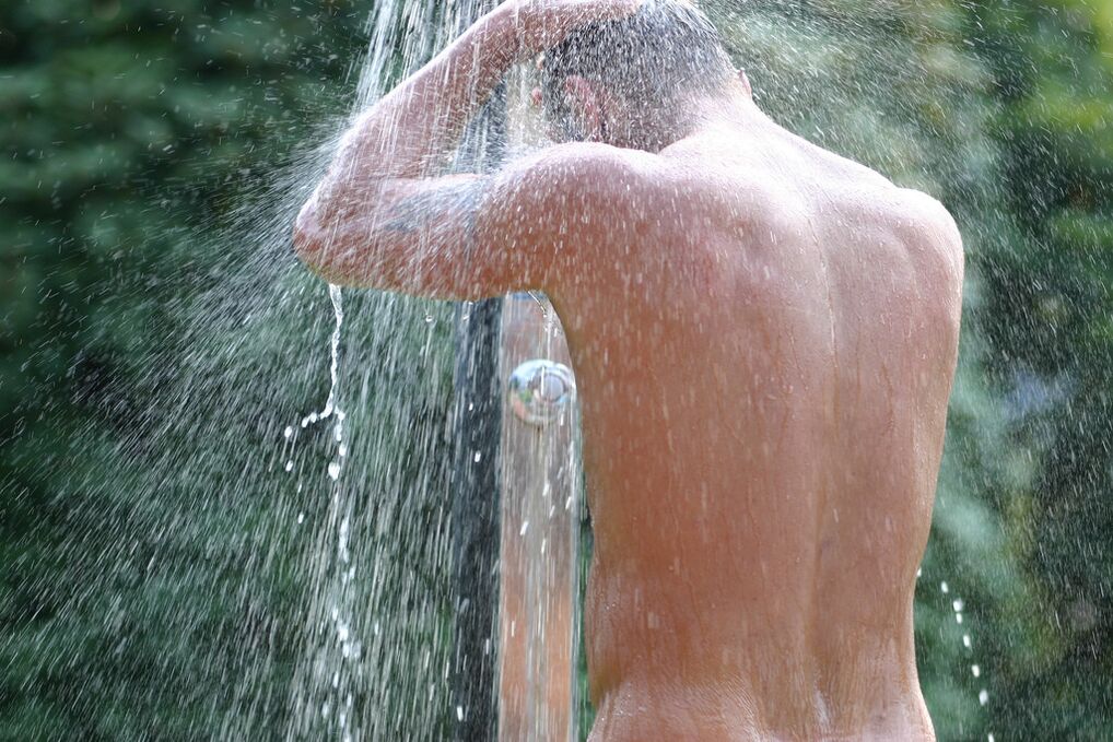 After taking a bath with soda, the man should take a cool shower. 